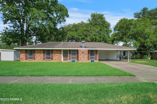 102 Lucas Cir, Lafayette, LA 70508 - ranch-style house featuring a front lawn, concrete driveway, a carport, and brick siding