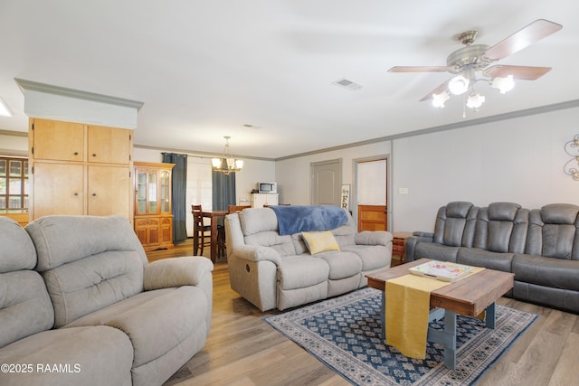 102 Lucas Cir, Lafayette, LA 70508 - living area featuring light wood-style floors, crown molding, a chandelier, and a ceiling fan