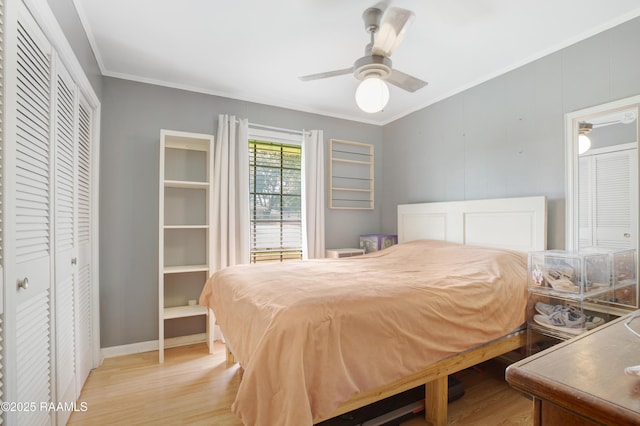 102 Lucas Cir, Lafayette, LA 70508 - bedroom with light wood finished floors, ornamental molding, a closet, ceiling fan, and baseboards