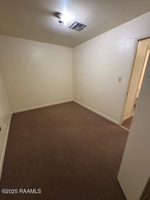 1500 Norman Bauer Dr, Franklin, LA 70538 - empty room featuring dark carpet and baseboards