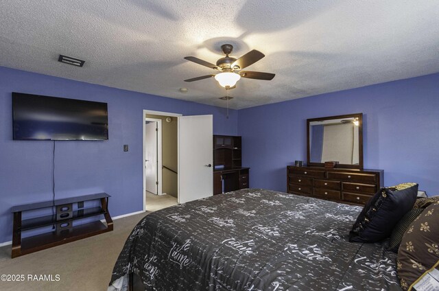 16 Heather Row, Lafayette, LA 70507 - carpeted bedroom with baseboards, a textured ceiling, and a ceiling fan