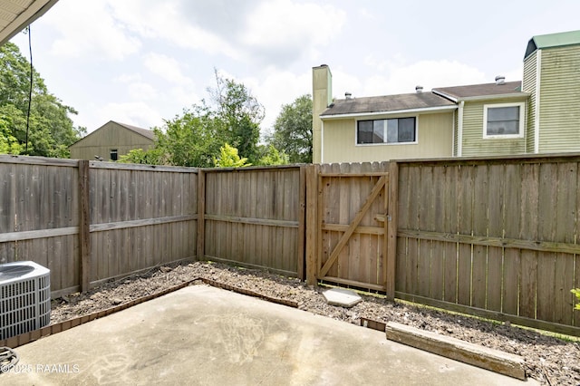 16 Heather Row, Lafayette, LA 70507 - fenced backyard with a patio, a gate, and central AC unit