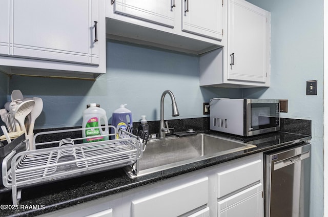 16 Heather Row, Lafayette, LA 70507 - kitchen with appliances with stainless steel finishes, white cabinetry, and a sink