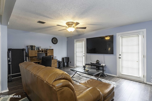 16 Heather Row, Lafayette, LA 70507 - living area featuring a ceiling fan, an office area, wood finished floors, a textured ceiling, and healthy amount of natural light