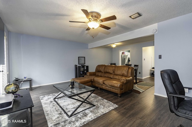16 Heather Row, Lafayette, LA 70507 - living area with a ceiling fan, baseboards, dark wood-style floors, a textured ceiling, and a desk