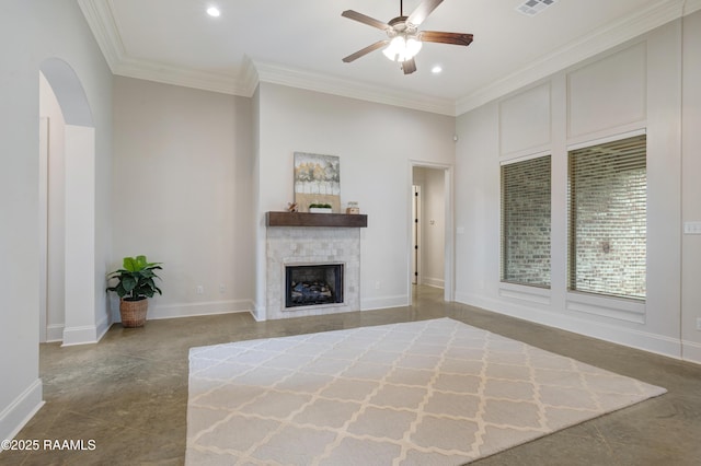 203 Sanctuary Ln, Lafayette, LA 70503 - unfurnished living room featuring ceiling fan, arched walkways, ornamental molding, a fireplace, and recessed lighting