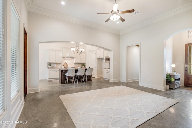 203 Sanctuary Ln, Lafayette, LA 70503 - living room featuring arched walkways, a chandelier, ceiling fan, ornamental molding, and baseboards