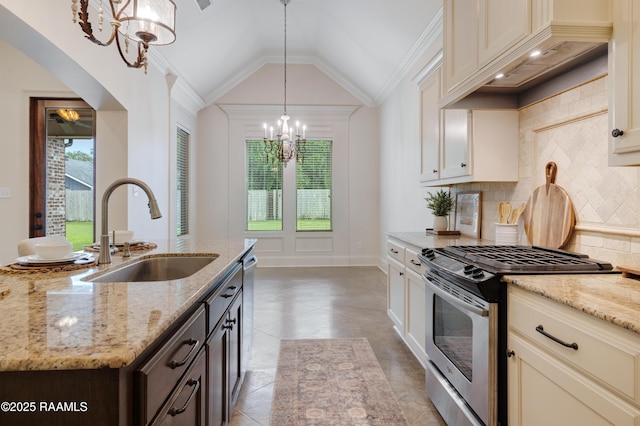 203 Sanctuary Ln, Lafayette, LA 70503 - kitchen with appliances with stainless steel finishes, a sink, a chandelier, backsplash, and light stone countertops