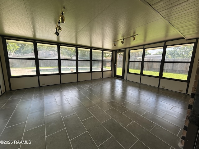 106 Dove Cir, Lafayette, LA 70508 - unfurnished sunroom featuring track lighting, plenty of natural light, and tile patterned floors