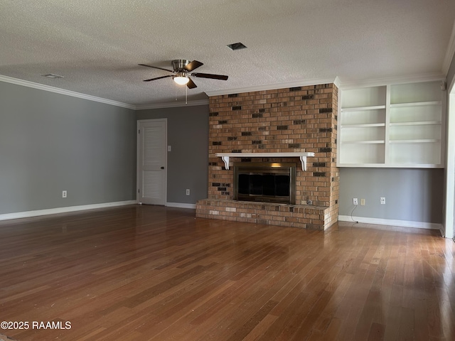 106 Dove Cir, Lafayette, LA 70508 - unfurnished living room with ceiling fan, hardwood / wood-style floors, a fireplace, a textured ceiling, and baseboards