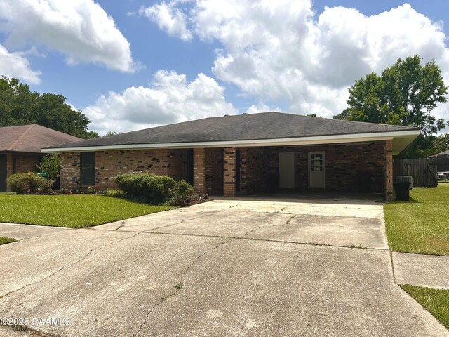 106 Dove Cir, Lafayette, LA 70508 - ranch-style home with driveway, an attached carport, and brick siding