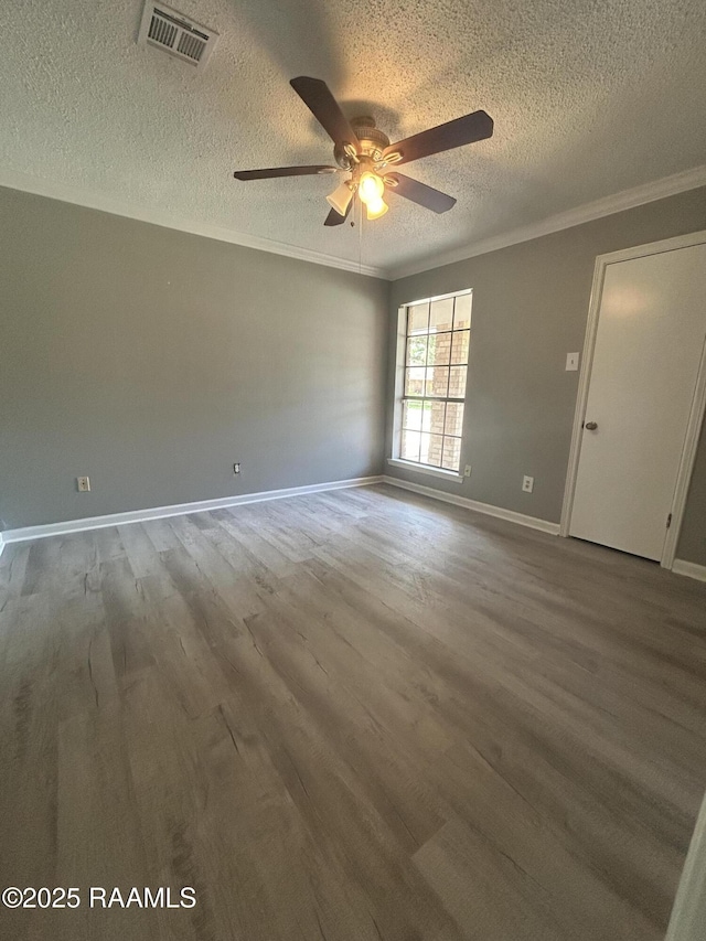 106 Dove Cir, Lafayette, LA 70508 - empty room with a textured ceiling, a ceiling fan, wood finished floors, ornamental molding, and baseboards
