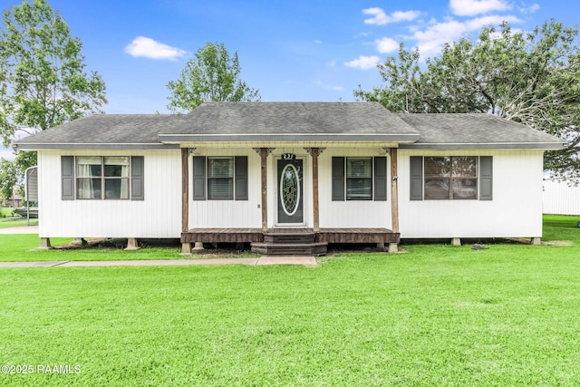 231 La Compagne St, Opelousas, LA 70570 - view of front of house with a front lawn, covered porch, and roof with shingles