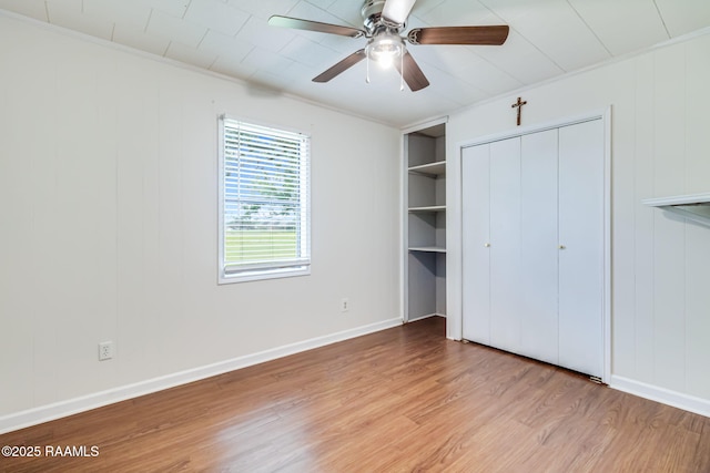 231 La Compagne St, Opelousas, LA 70570 - unfurnished bedroom with light wood-style floors, ornamental molding, baseboards, and ceiling fan