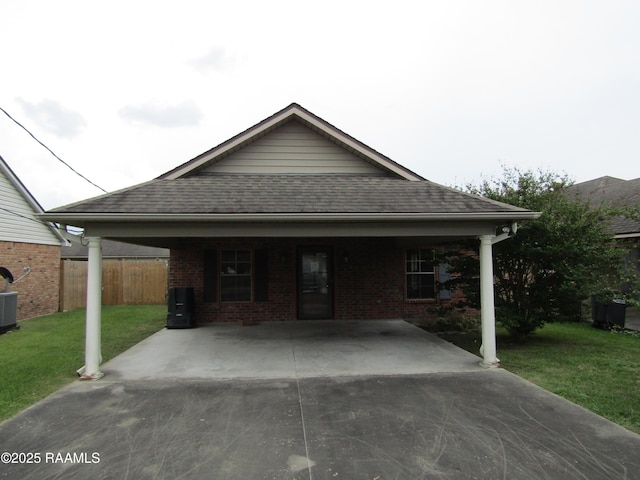 1503 S Patout St, New Iberia, LA 70560 - view of front facade with brick siding, a shingled roof, and central air condition unit