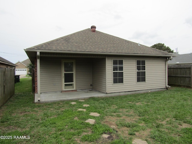 1503 S Patout St, New Iberia, LA 70560 - rear view of property with roof with shingles and a patio
