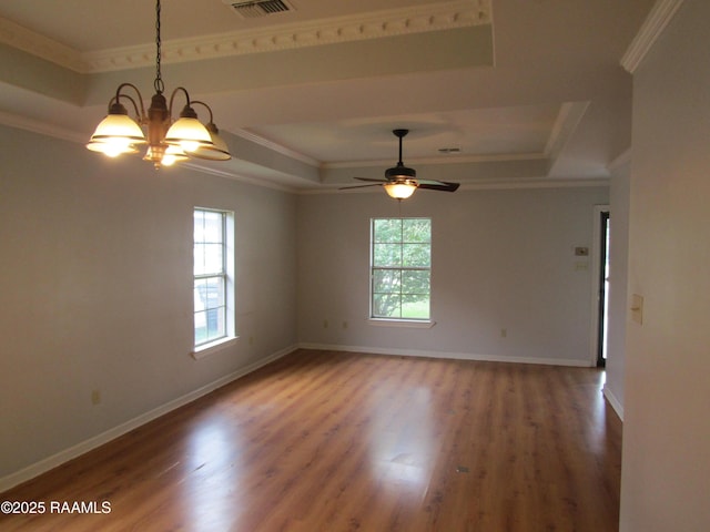 1503 S Patout St, New Iberia, LA 70560 - spare room featuring a tray ceiling, a ceiling fan, wood finished floors, and crown molding