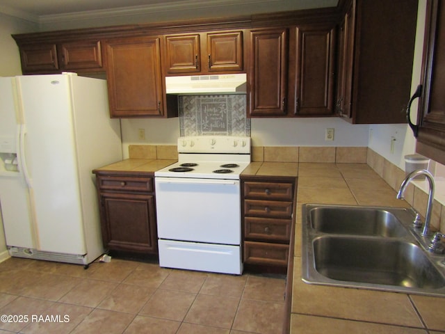 1503 S Patout St, New Iberia, LA 70560 - kitchen featuring white appliances, under cabinet range hood, a sink, tile countertops, and ornamental molding