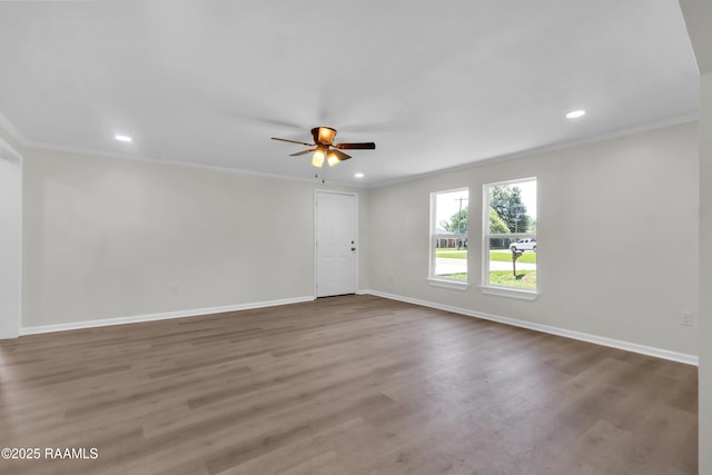 630 Ledoux St, Jennings, LA 70546 - spare room featuring ceiling fan, crown molding, baseboards, wood finished floors, and recessed lighting