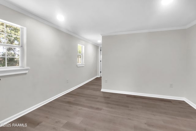 630 Ledoux St, Jennings, LA 70546 - unfurnished room with ornamental molding, plenty of natural light, wood finished floors, baseboards, and recessed lighting