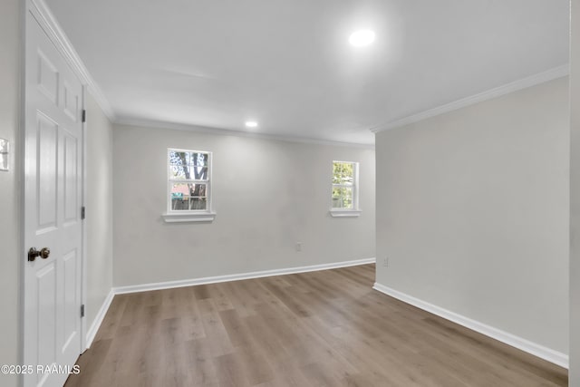 630 Ledoux St, Jennings, LA 70546 - unfurnished room with crown molding, light wood finished floors, baseboards, and recessed lighting