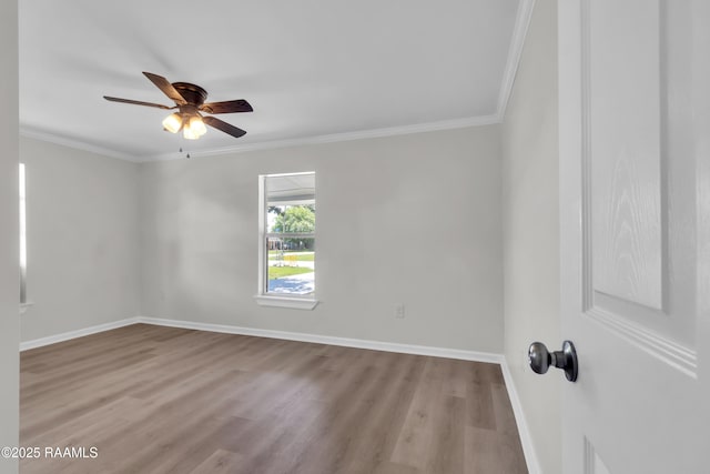 630 Ledoux St, Jennings, LA 70546 - empty room featuring wood finished floors, ceiling fan, baseboards, and ornamental molding