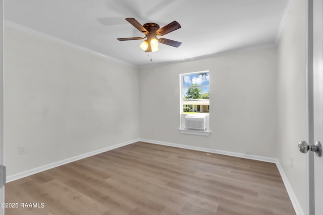 630 Ledoux St, Jennings, LA 70546 - empty room featuring ornamental molding, a ceiling fan, wood finished floors, cooling unit, and baseboards