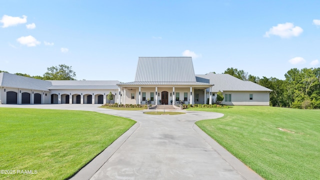 235 N Fieldspan Rd, Scott, LA 70583 - view of building exterior featuring curved driveway and a garage