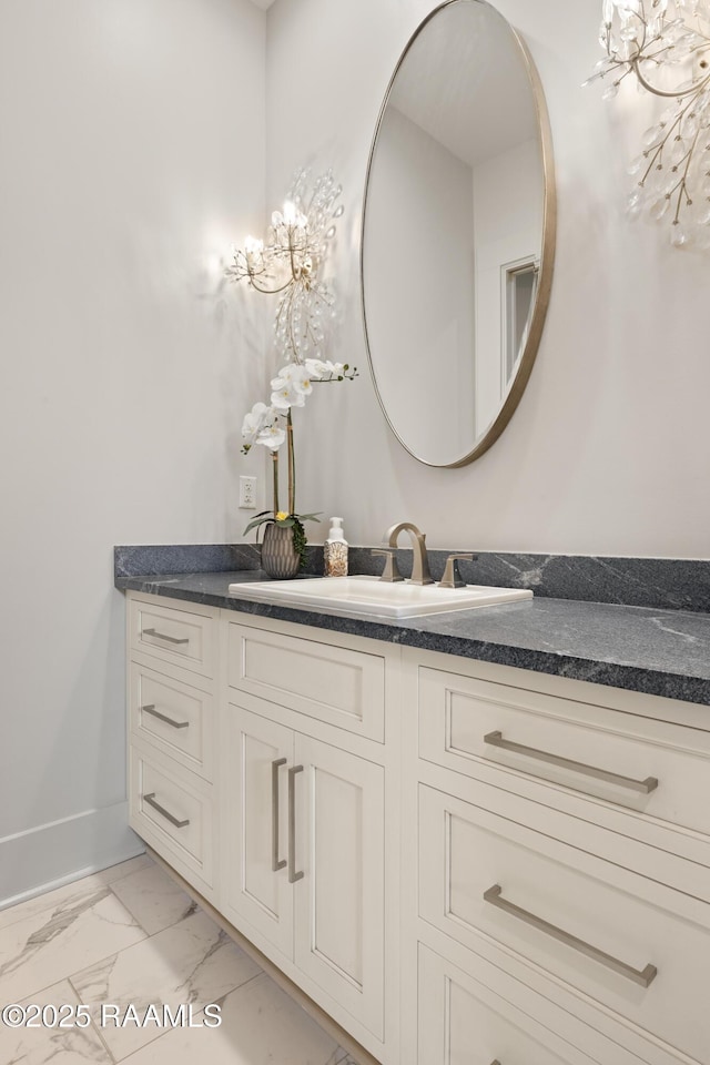 235 N Fieldspan Rd, Scott, LA 70583 - bathroom featuring vanity, marble finish flooring, and baseboards