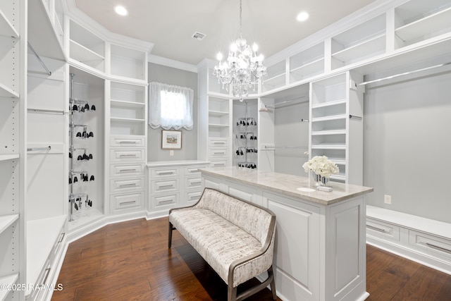 235 N Fieldspan Rd, Scott, LA 70583 - spacious closet featuring dark wood-style flooring and a chandelier