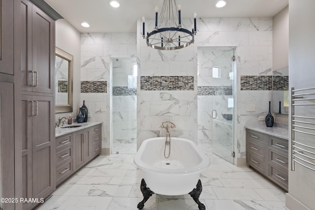 235 N Fieldspan Rd, Scott, LA 70583 - bathroom with marble look tile flooring, vanity, a marble finish shower, a chandelier, and recessed lighting