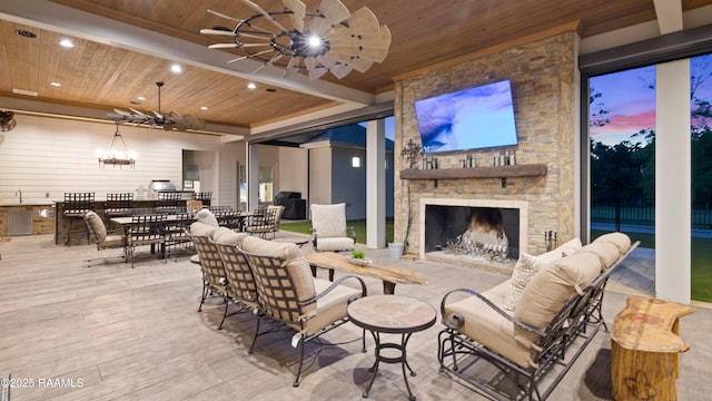 235 N Fieldspan Rd, Scott, LA 70583 - view of patio featuring ceiling fan, an outdoor stone fireplace, and a sink