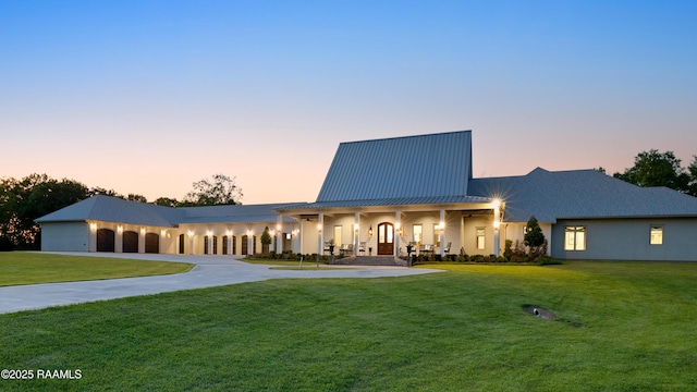 235 N Fieldspan Rd, Scott, LA 70583 - view of front of property with a yard, curved driveway, a porch, and metal roof