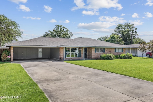 421 Karen Dr, Lafayette, LA 70503 - single story home with an attached carport, concrete driveway, a front yard, brick siding, and a shingled roof