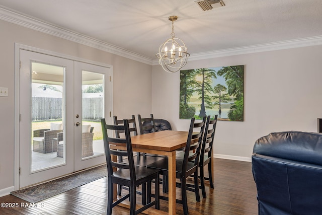 421 Karen Dr, Lafayette, LA 70503 - dining space with french doors, crown molding, a chandelier, baseboards, and dark wood-style floors