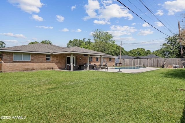 421 Karen Dr, Lafayette, LA 70503 - rear view of property featuring brick siding, a patio, and a shingled roof
