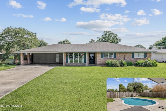 421 Karen Dr, Lafayette, LA 70503 - single story home featuring an attached carport, brick siding, driveway, and roof with shingles