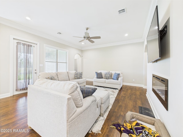 120 Old Heritage Ln, Carencro, LA 70520 - living room with dark wood-type flooring, a ceiling fan, recessed lighting, baseboards, and crown molding