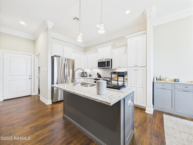 120 Old Heritage Ln, Carencro, LA 70520 - kitchen featuring appliances with stainless steel finishes, a sink, dark wood finished floors, tasteful backsplash, and ornamental molding