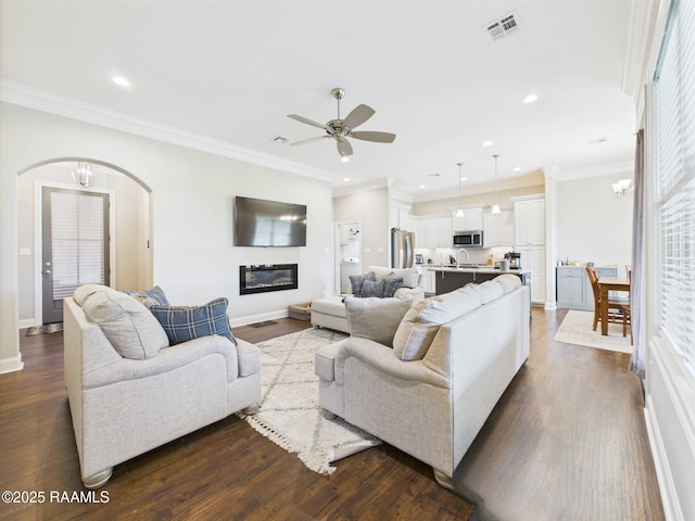 120 Old Heritage Ln, Carencro, LA 70520 - living area featuring arched walkways, ceiling fan, dark wood-style floors, baseboards, and recessed lighting