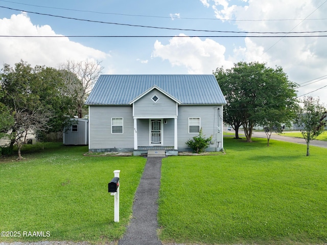 306 Oak St, Iota, LA 70543 - view of front of property with a front lawn, covered porch, and metal roof