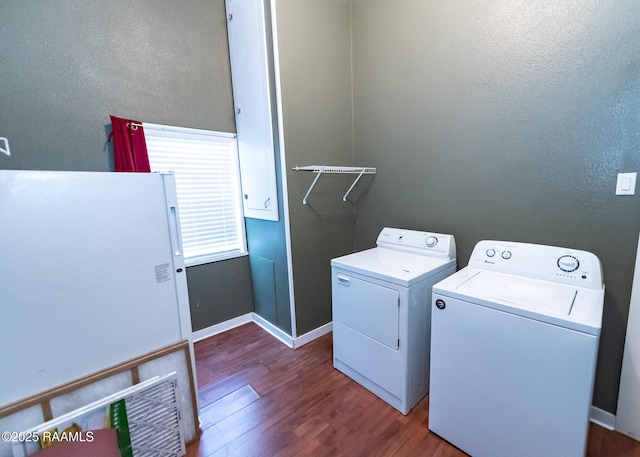 306 Oak St, Iota, LA 70543 - laundry room with washing machine and clothes dryer, dark wood-style floors, baseboards, and a textured wall