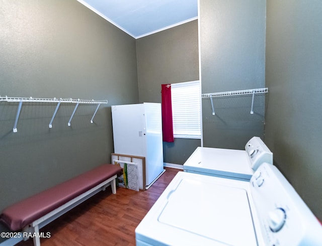 306 Oak St, Iota, LA 70543 - washroom with washing machine and clothes dryer, wood finished floors, and ornamental molding