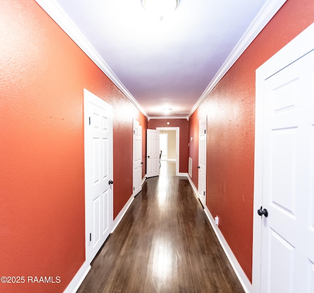 306 Oak St, Iota, LA 70543 - hallway with dark wood finished floors, crown molding, baseboards, and a textured wall