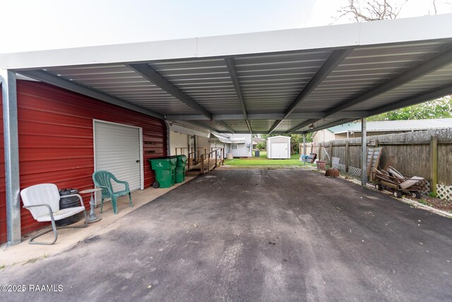 306 Oak St, Iota, LA 70543 - view of vehicle parking with a storage shed