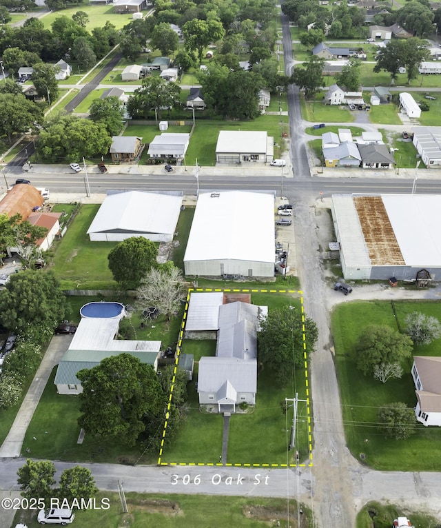 306 Oak St, Iota, LA 70543 - aerial view of property's location featuring property boundaries highlighted and nearby suburban area