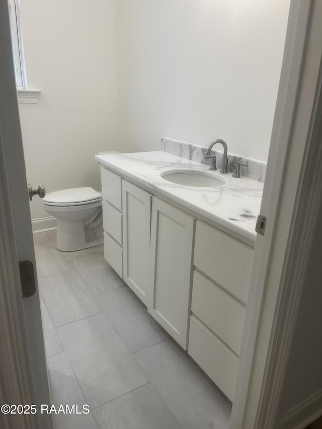 203 Redfern St, Lafayette, LA 70508 - bathroom featuring vanity, toilet, and tile patterned flooring