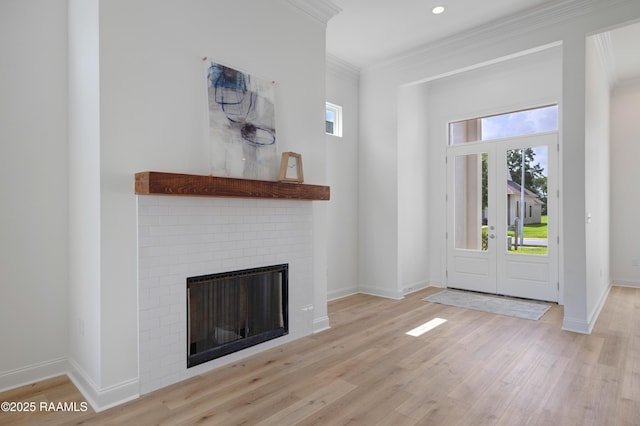 203 Redfern St, Lafayette, LA 70508 - unfurnished living room featuring crown molding, wood finished floors, a fireplace, and recessed lighting