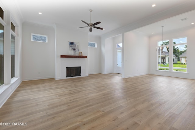 203 Redfern St, Lafayette, LA 70508 - unfurnished living room featuring light wood-style flooring, a fireplace, recessed lighting, crown molding, and ceiling fan