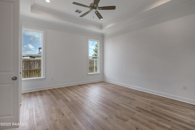 203 Redfern St, Lafayette, LA 70508 - spare room featuring a raised ceiling, light wood finished floors, ornamental molding, ceiling fan, and recessed lighting